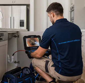 Clearing a blocked sink at a Yowie Bay property